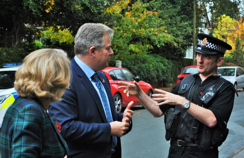 Mary Robinson pictured with Mr Lewis and police officers.