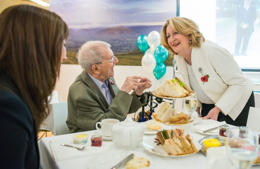 Mary chatting with guests.